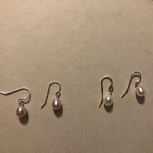 Two pairs of drop freshwater pearl earrings. Pink and white